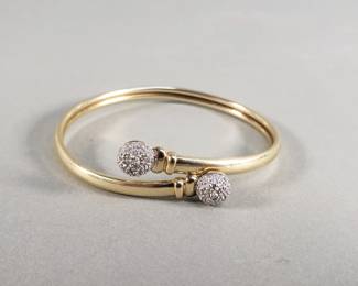 009  Lot 158  14k gold and diamond bangle bracelet