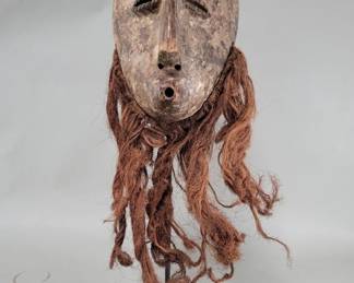 123  Lot 101  Lega beaded carved wood mask rubbed with clay