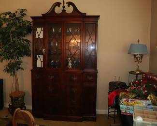 vintage mahogany breakfront china cabinet featuring a drop-front secretary desk