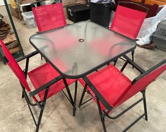 Glass Top Patio Table Four Red Folding Patio Chairs