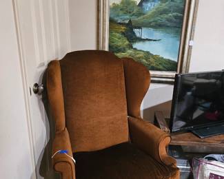 Brown wing back chair