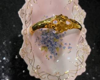 This is a vintage Heinrich & Co. pink porcelain handled trinket dish with floral decoration.