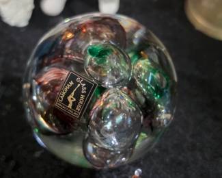 This is a vintage Langham Glass House purple and green bubble paperweight.