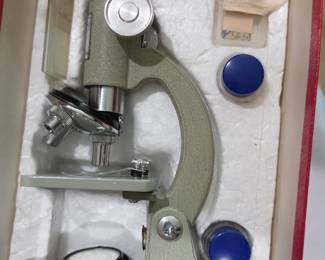 This is a vintage Sears Model 6366 student microscope set.