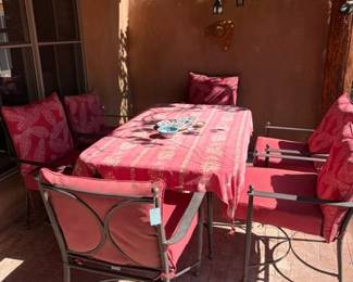 Glass and metal patio table with 6 chairs