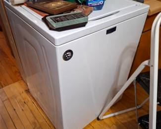 Maytag White Household Laundry Appliance with Classic Chrome & Blue Brand Emblem