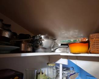 Assorted Kitchen Cookware, Stainless Steel Pots and Pans, Metal Colanders, Mixing Bowls, Cooking Utensils and Wicker Storage Baskets