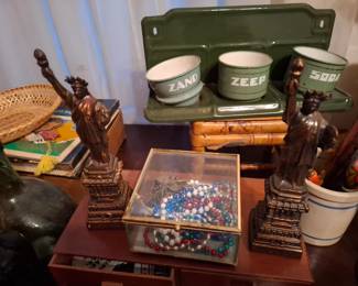 Statue of Liberty Souvenir Figurines, Green Enamelware Zand Zeep Soda Kitchen Wall Rack, Glass Jewelry Display Box with Beaded Necklaces & Assorted Decorative Collectibles