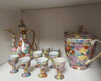Vintage Chinese Porcelain set featuring a colorful "mille-fleur" or "thousand flowers" pattern with gold gilt accents