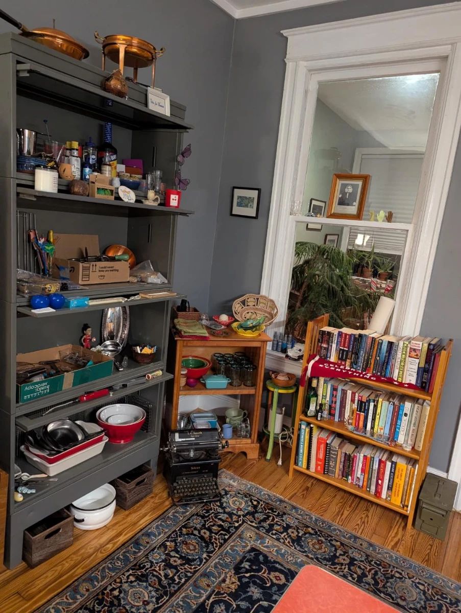 books, cooking and entertainment items, typewriter, art, rug