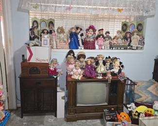 Collectable dolls. Vintage TV and cabinet