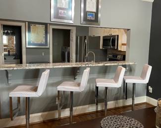 Contemporary faux leather and silver swivel barstools w/ footrest
