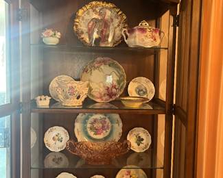 China cabinet and many antique plates