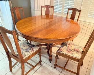 Antique oak table with 6 matching chairs