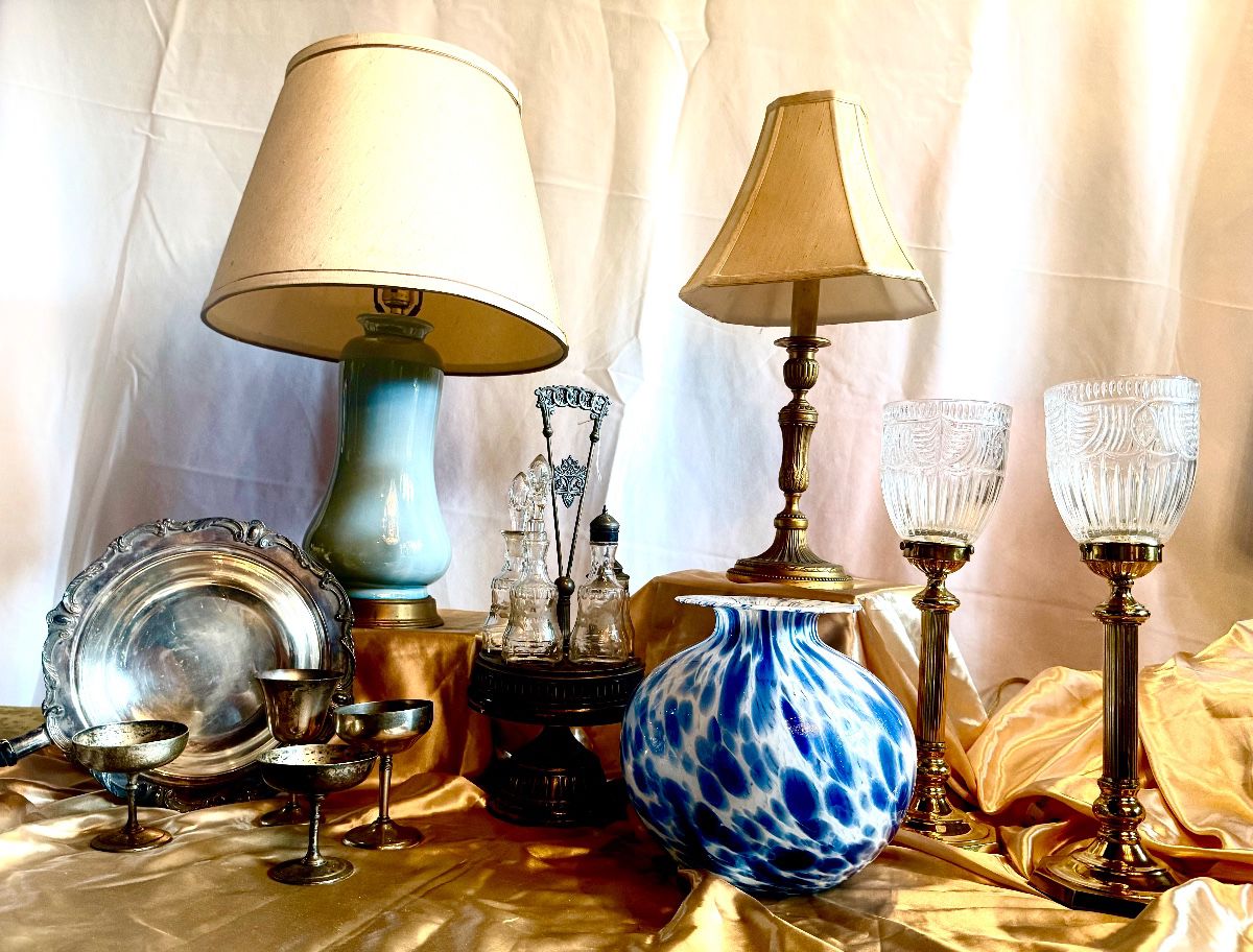 Many lamps, pewter and silver plated serving pieces. 