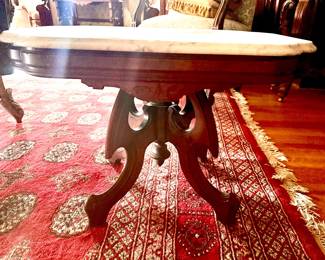 One of several Victorian marble top tables 