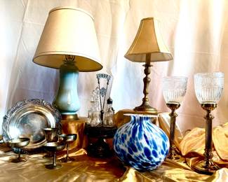 Many lamps, pewter and silver plated serving pieces. 