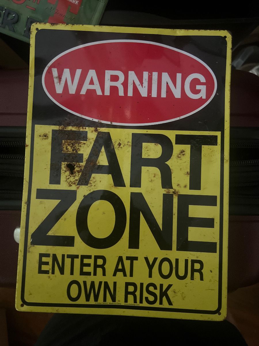 novelty metal wall sign featuring a humorous joke.