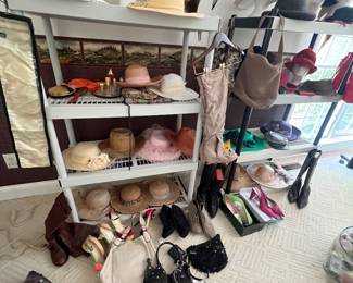 collection of vintage-style hats, wigs on display heads, handbags, and boots