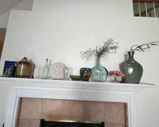 vintage glass vases, ceramic jars, and floral accents.