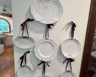 set of white porcelain pierced or reticulated wall-hanging decorative plates