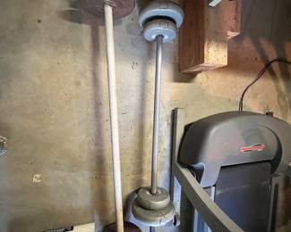 vintage standard barbells loaded with cast-iron and cement-filled weight plates