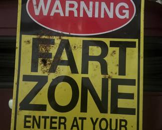 novelty metal wall sign featuring a humorous joke.