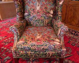 Wing Back Chair with Nailhead Trim Upholstered in Deer Motif Pattern. Measures 32" W x 34" D with 18" Seat Height. Photo 1 of 8.