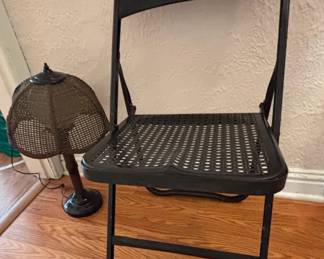 Black Metal Mesh Pattern Folding Chair With Vintage Faux Bambo Rattan Table Lamp