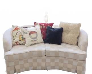 Upholstered Curved Loveseat with Skirted Base