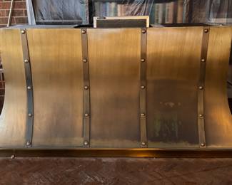Custom Brushed Brass , Wall-Mounted Kitchen Range Hood with Decorative Metal Straps. Measures 70" W x 20" D x 35" H. Photo 1 of 2.