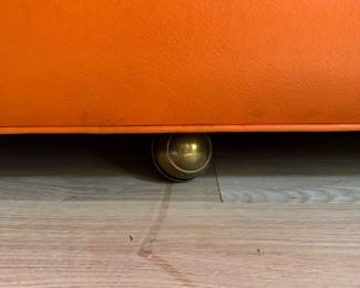 Hermes-Orange Color Vinyl Upholstered Sleeper Sofa. Slight Tear on Fabric. Measures 106" W x 36" D. Photo 6 of 6.