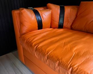 Hermes-Orange Color Vinyl Upholstered Sleeper Sofa. Slight Tear on Fabric. Measures 106" W x 36" D. Photo 4 of 6.