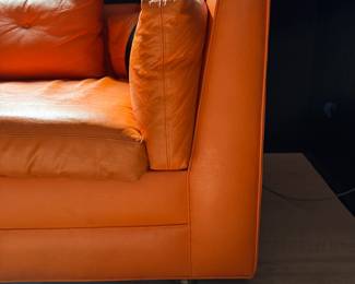 Hermes-Orange Color Vinyl Upholstered Sleeper Sofa. Slight Tear on Fabric. Measures 106" W x 36" D. Photo 2 of 6.