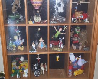 Collection of Assorted Figurines in Wooden Display Case