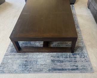 Ashley Watson Oversized Coffee Table – $175 56” × 42” dark brown cocktail table.