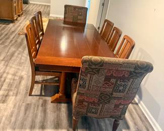 Bassett Chris Madden “Getaways” 9-Piece Dining Set — $850 High-quality Bassett Chris Madden Collection dining set in Heirloom Cherry finish. Includes expandable dining table, 6 wood side chairs with black leather seats, and 2 upholstered host chairs. Very good condition with light normal wear.