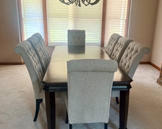 Ashley Furniture 7-Piece Dining Set — $650 Includes Ashley Hayley extension dining table and 6 Tripton tufted dining chairs. Table: 70”L × 40”W × 30”H, extending to 88”L with the included 18” leaf. Chairs: 20.25”W × 28”D × 42.5”H each