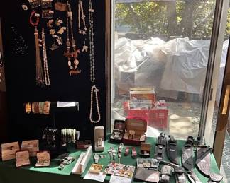 Jewelry section including Jade bracelets and some gold and silver items