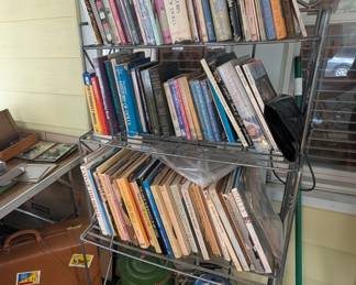 Books on collectable dolls. Vintage tea pot. Folding shelf.