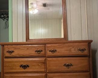 Dresser that has a matching bedside piece