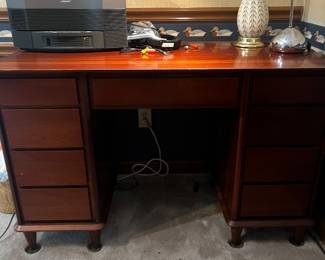 Davis cabinet co desk with drawers on both sides. Vintage lamp and Bose stereo system.