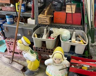 outdoor cement statues of little dutch kids. Sorry its a terrible picture lol 