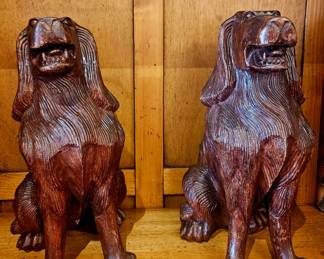 2 carved dogs