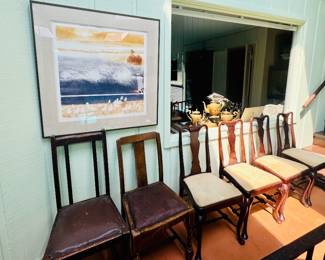 Art by the pool and selection of wooden chairs from the ranch priced great!
