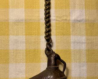 antique brass bird-shaped hanging oil lamp, often referred to as a hanging diya