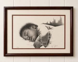 framed graphite pencil drawing of a sleeping child, numbered 67/200