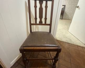 Chair in basement level with pool table