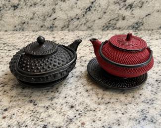 Two traditional Japanese-style cast iron teapots