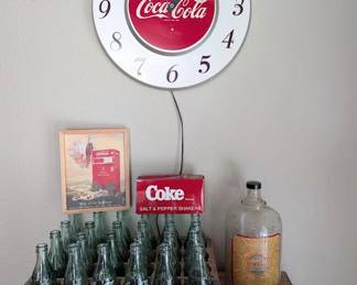 Vintage Coca-Cola advertising and soda fountain collectibles.